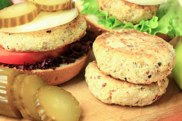 Vegan sea burger and patties closeup on wooden surface