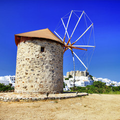 Fototapeta na wymiar windmills of Greece - Patmos island, view with monastery