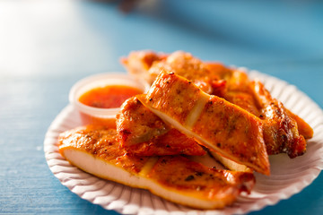 grilled chicken on paper dish