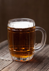 Beer beverage in glass on vintage background for patricks day