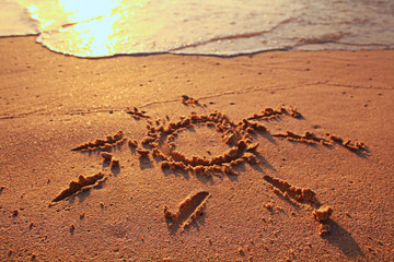drawing on the sand sea surf