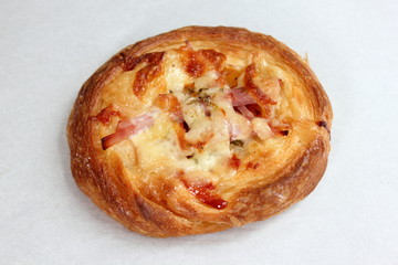 Pizza with ham, cheese and  on white