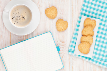 Coffee, heart shaped cookies and notepad
