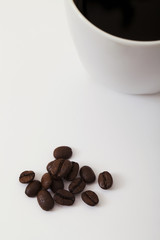 Roasted coffee beans on the white background