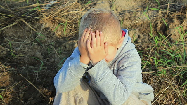 boy crying closed face