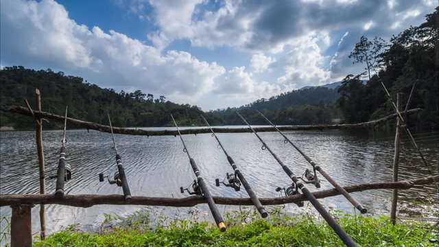 The row of hook place for fishing at reservoir with passing clou