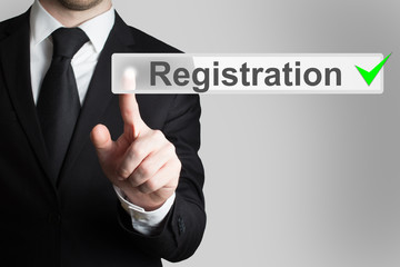 businessman pressing button registration