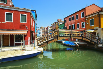 Fototapeta na wymiar Venice landmark, Burano island canal, bridge, colorful houses an
