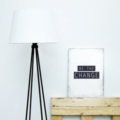 Motivational hipster board BE THE CHANGE with lamp. Scandinavian