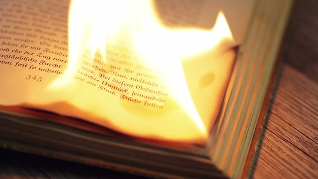 Burning antique book