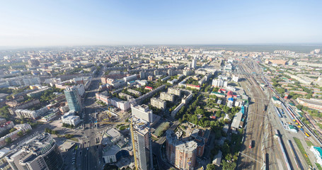 Aerial city view with crossroads buildings and parks