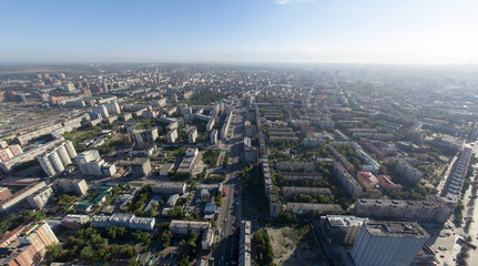 Aerial city view with crossroads buildings and parks