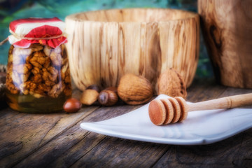 nuts in honey and honey dipper