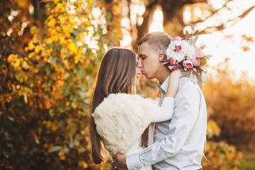Fototapeta premium Young couple in love. Man kisses a woman's nose