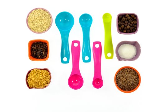 Seeds, spices, grains in small multi-colored cups