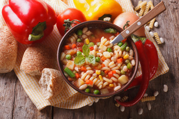 minestrone soup and ingredients. horizontal top view closeup