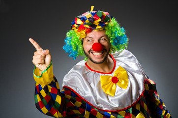 Funny clown in colourful costume