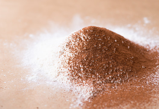 Heap of wheat flour and cocoa powder