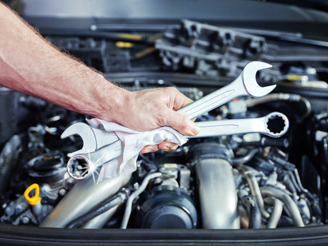 Combination wrench in front of motor