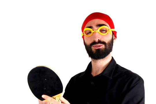 Man playing ping pong wearing swimming cap - Powered by Adobe