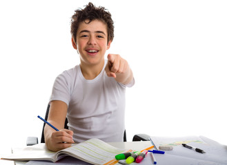 teenager boy on homework smiling and pointing index finger