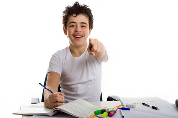 Fototapeta na wymiar teenager boy on homework smiling and pointing index finger