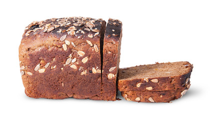 Half and slices of black unleavened bread with seeds