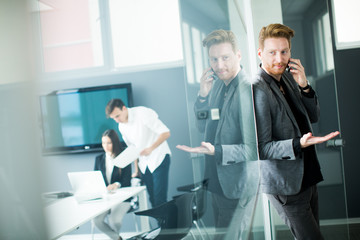 Obraz premium Young man with mobile phone