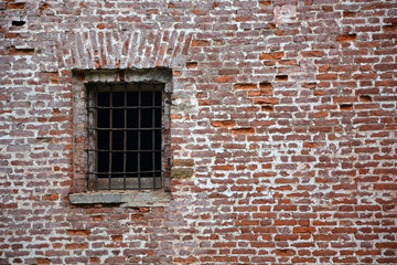 Fototapeta na wymiar Old window with bars as a background