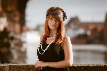 Flapper girl woman in1920s style portrait outdoor