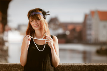 Flapper girl woman in1920s style portrait outdoor