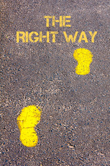 Yellow footsteps on sidewalk towards The Right Way message