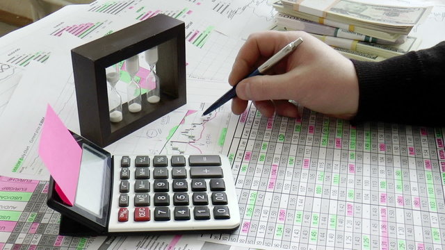 Graphs, charts, business table with banknotes