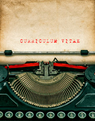 Vintage typewriter with textured grungy paper. Curriculum vitae