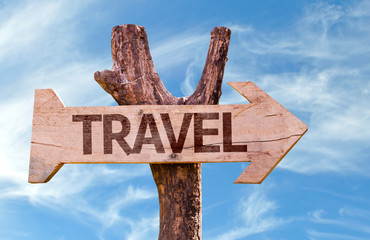 Travel wooden sign with sky background