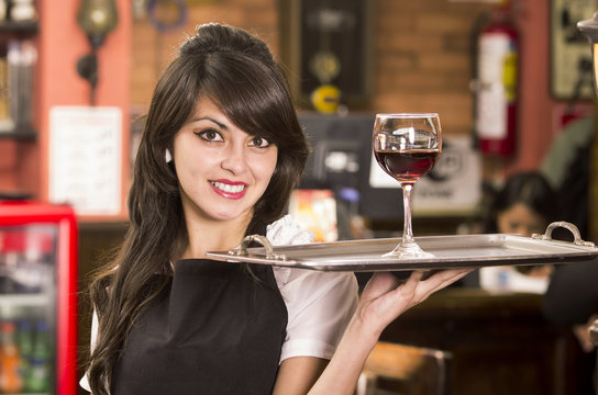 Beautiful Young Waitress Girl Serving A Drink