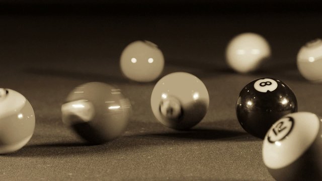 Playing billiard game on pool table