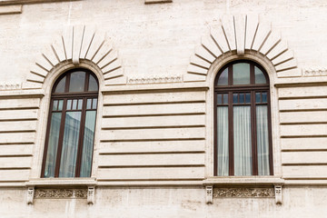 Fototapeta na wymiar Windows of historical building in the center of Rome