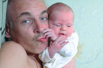 Dad playing with baby boy