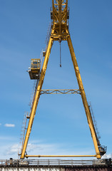 Gantry crane against the blue sky