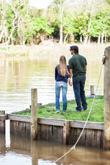 Couple Holding Hands On Pier