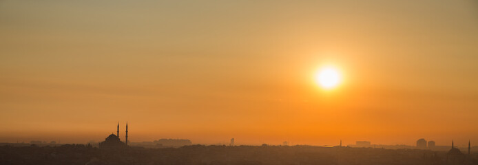 Istanbul mosque at sunset, high contrast profile, panoramic view