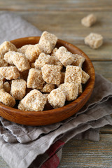 Brown sugar in a wooden bowl