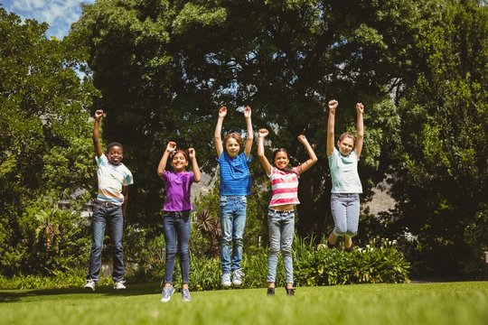 Children jumping at park