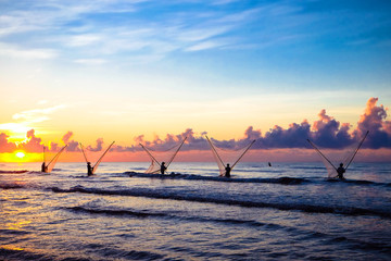 Fishermen fishing in the sea at sunrise in Namdinh, Vietnam