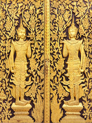 Thai culture gold sculpture on the temple wall