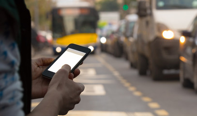 Using cellphone while crossing the street. Watch out!