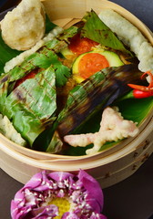 Red snapper fish fillet wraped in banana leaf  with tempura