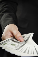 US dollars in a hand of businesswoman