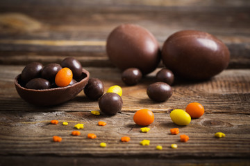 Chocolate Easter Eggs Over Wooden Background